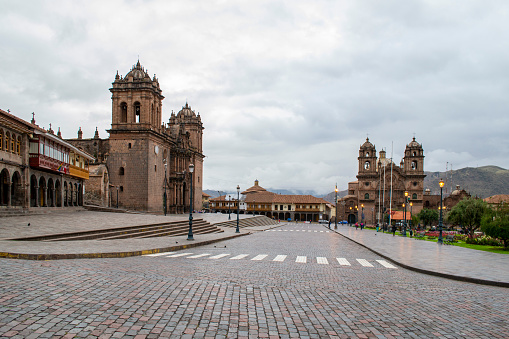 Plaza de Armas in Cusco early in the morning, very few people in the streets.