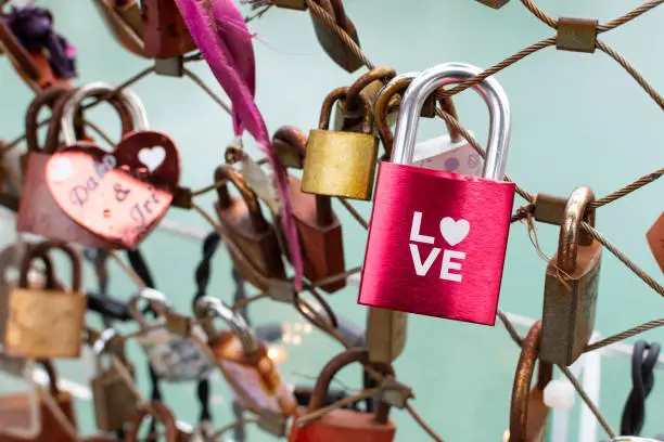 Photo of Beautiful shot of colored padlocks with heart shape - Valentine's Day concept