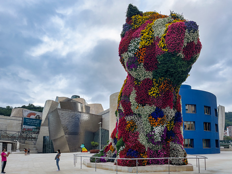Bilbao, Biscay, Spain – September 08, 2020:Tourists take photos at the big flower dog \
