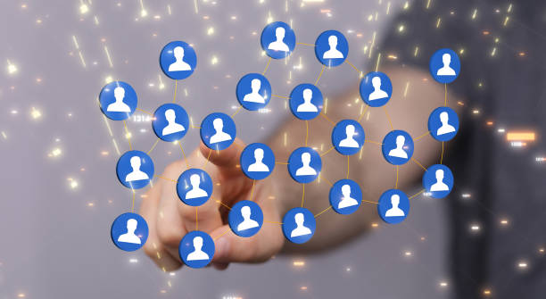 istock Man's hand clicking on a 3d rendered connection icons - Teamwork concept 1456131592