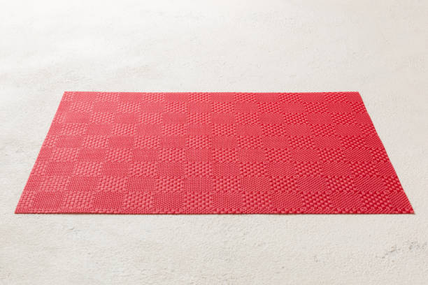 istock Perspective view of red tablecloth for food on cement background. Empty space for your design 1456135141