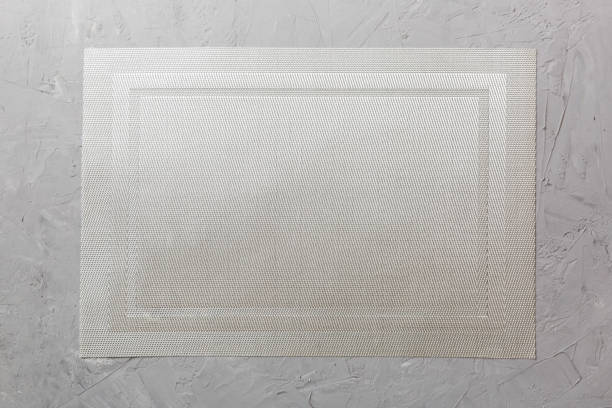 istock Top view of grey tablecloth for food on cement background. Empty space for your design 1456135176