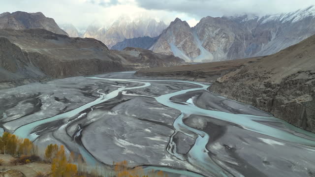 Scenic aerial view of hunza river in Karakoram Range in Himalayas mountains along Karakoram Highway in autumn. Northern Pakistan