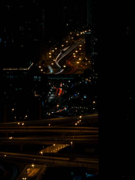 istock High and tall building with city lights during night time 1456138019