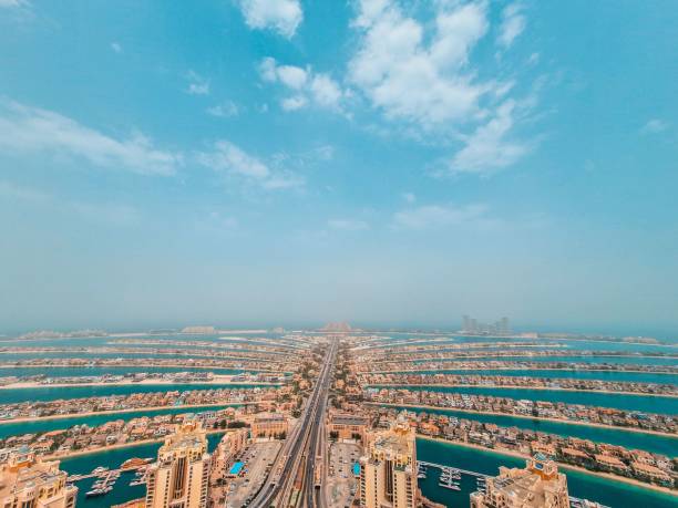 istock Tall and high buildings with a cloudy blue sky above 1456138252
