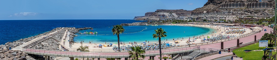 Puerto Ric, Spain – May 05, 2022: a Panoramic view of Playa Amadores beach, Gran Canaria island, Spain