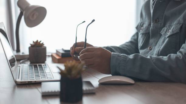 istock Man working at his home office desk 1456139559