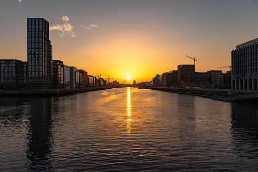 A beautiful view of sunset at Samuel Beckett Bridge crossing the River Liffey. Dublin, Ireland 2021