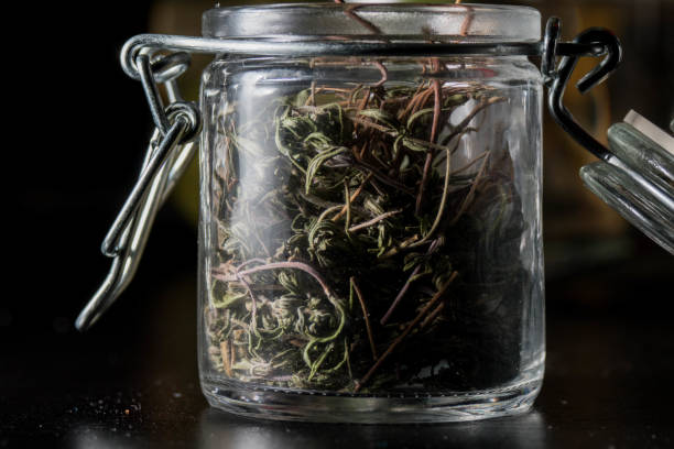 istock Dried tea leaves in a glass jar 1456142010