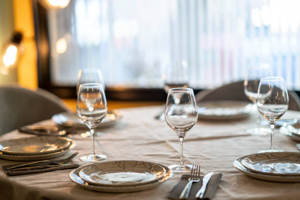 istock Shallow focus beautiful table setting with crockery and glasses for an event in the restaurant 1456143340