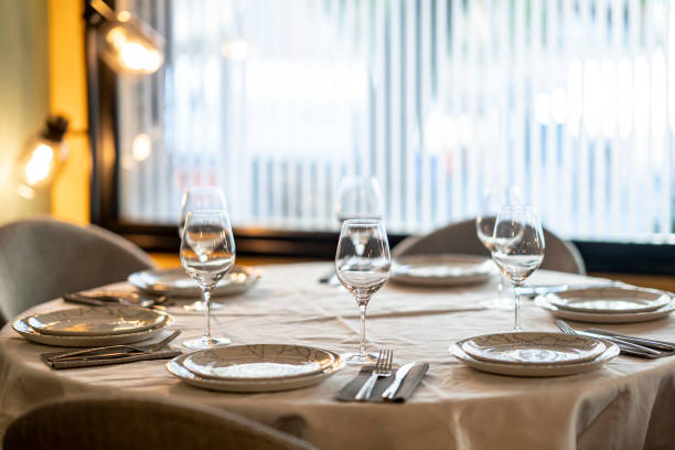 istock Shallow focus beautiful table setting with crockery and glasses for an event in the restaurant 1456143341