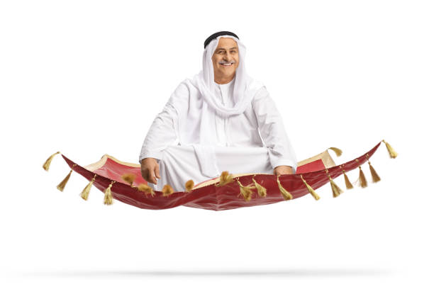 istock Mature man sitting on a carpet and flying 1456145424