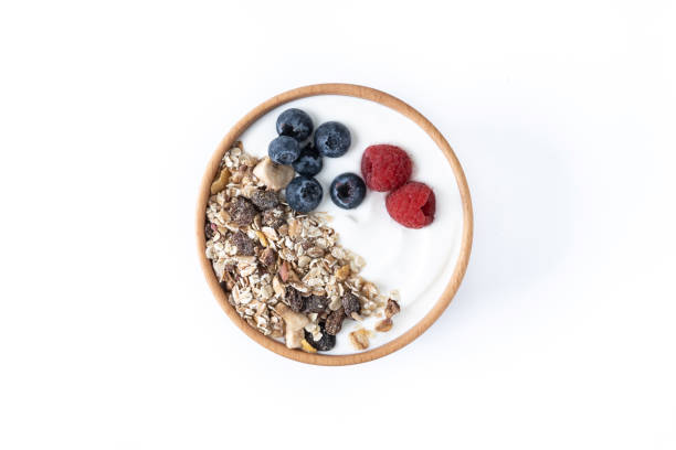 istock Yogurt with berries and muesli for breakfast in bowl 1456148092