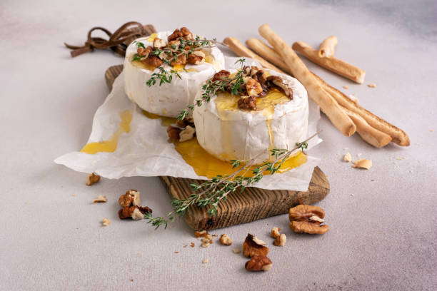 istock Brie cheese or camembert with thyme, walnut and honey 1456155480