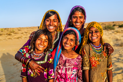 Group of happy Gypsy Indian children - desert village, Thar Desert, Rajasthan, India.