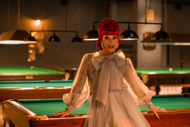 Drag Queen in a pool hall Drag Queen in a pool hall Crossdresser Posing stock pictures, royalty-free photos & images