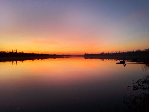 Ukrainian river Dnieper at sunset. Winter 2022