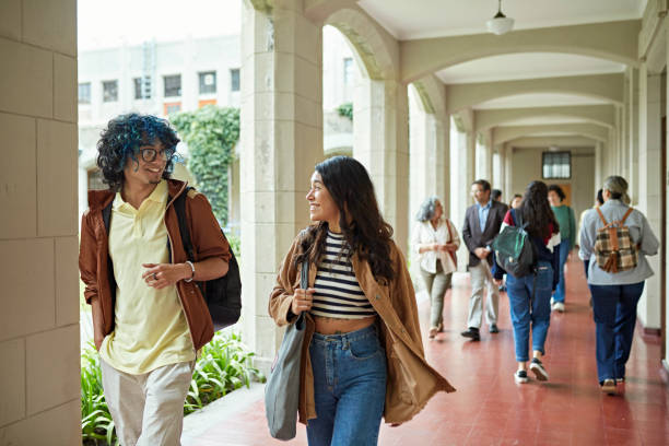 istock Young college friends walking to class 1456163267