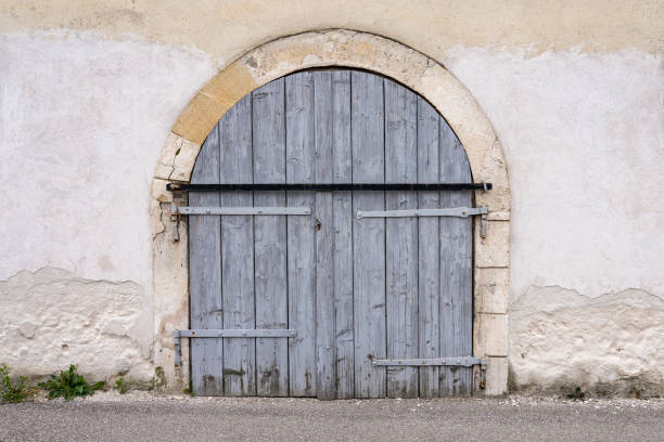 istock An old wall with an old wooden gate 1456163749