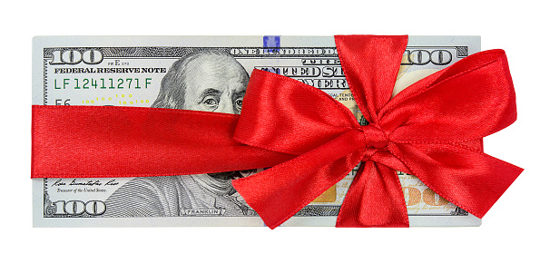 One hundred dollar bills with red ribbon bow isolated on white background
