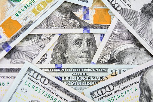 President Benjamin Franklin portrait in the frame of one hundred dollar bills. Business concept