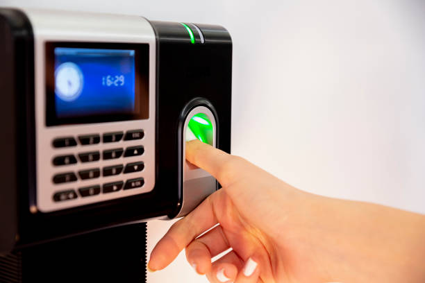 Finger print scan security system on wall in a office building stock photo