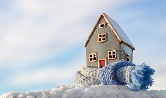 House and home winter heating and insulation background fuel and energy crisis concept