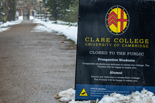 Clare College sign Cambridge University, Cambridge, Cambridgeshire, England, UK.  This is beside the entrance gate on the Backs and shows that the College is closed to the public.