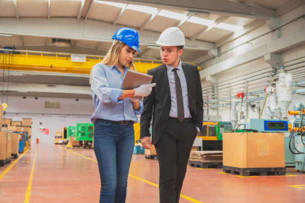 istock Business colleagues working with tablet computer in factory 1456166992