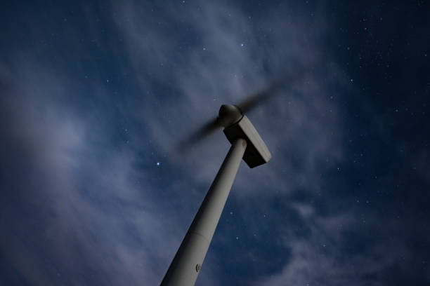 istock Wind Turbines working at night under the stars 1456167274