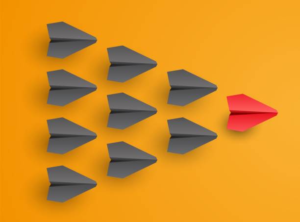 istock Business and leadership concept. Individual red leader paper plane lead other. Vector 1456168547