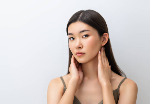 istock asian girl on grey background 1456170126