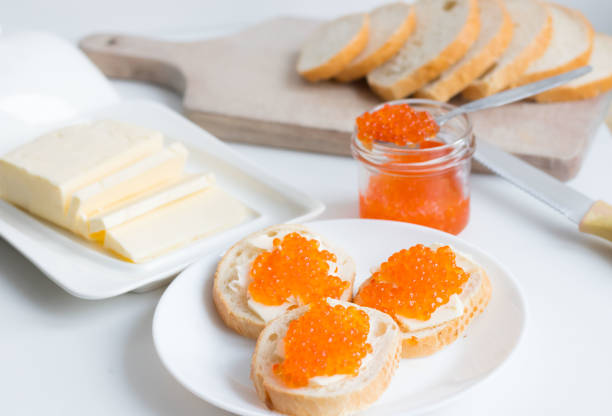 istock Slices of bread with red caviar on a plate 1456170886