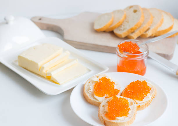 istock Slices of bread with red caviar on a plate 1456170895