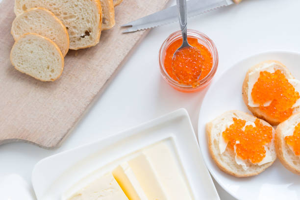 istock Slices of bread with red caviar on a plate 1456170900