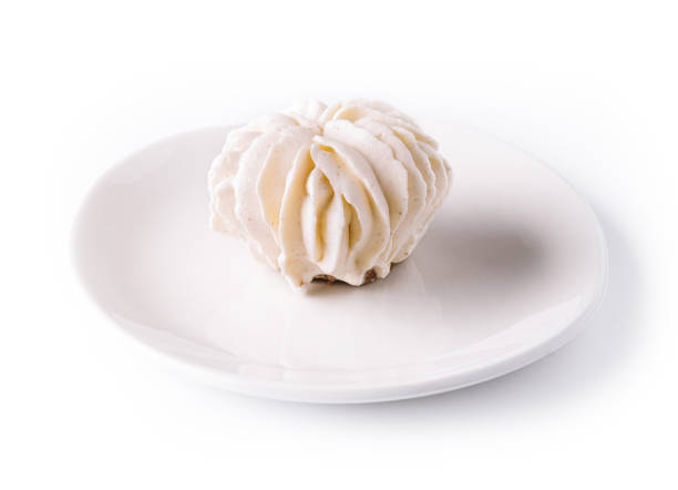 istock cake roll topping vanilla cream on plate 1456171284