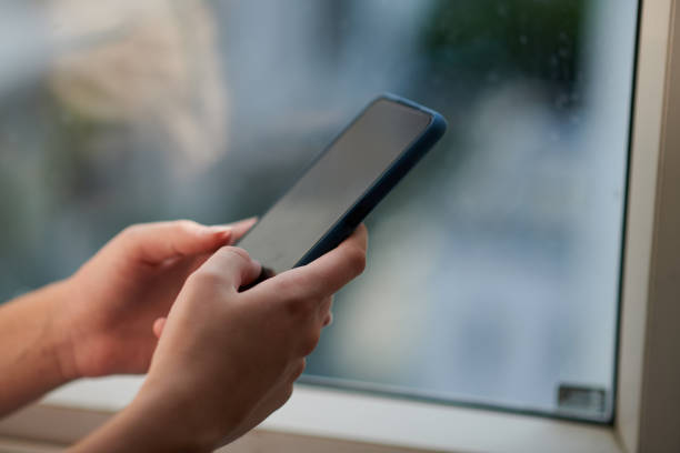 istock Woman Answering Text Mesages 1456171490