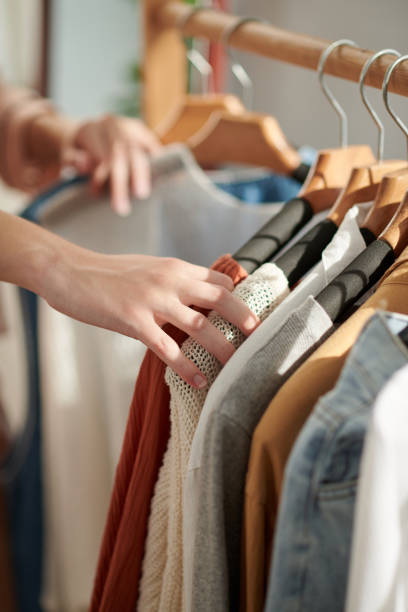 istock Woman Choosing Clothes in Closet 1456171492