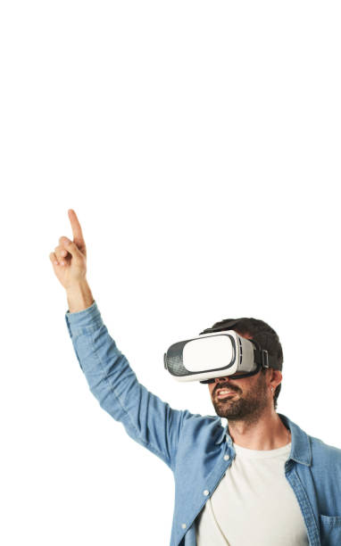 istock Smiling man wearing VR glasses with funny gesture isolated on white background 1456171707