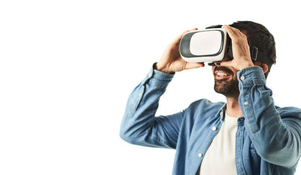 istock A smiling man with VR glasses with surprised gesture isolated on white background 1456171711