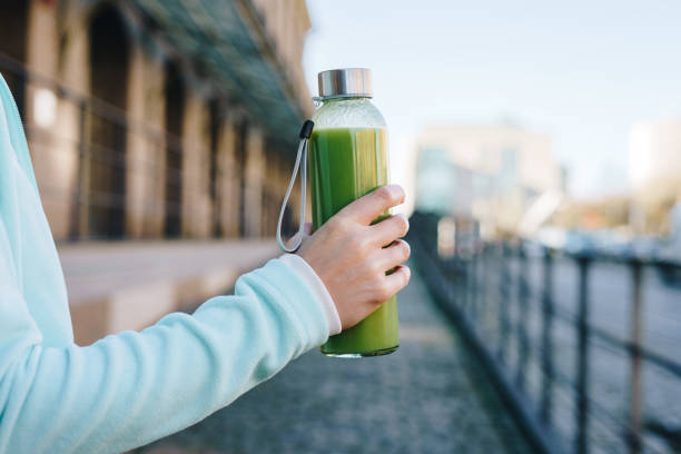 istock Woman drinking smoothie after workout outdoors 1456173590