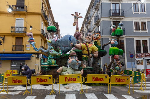 General view of a Falla during Las Fallas Festival on March 18, 2022 in Valencia, Spain. The Fallas is Valencias most international festival, which runs from March 15 until March 19. It celebrates the arrival of spring with fireworks, fiestas and bonfires made by large puppets named Ninots. During the months preceding this unique festivity, a lot of hard work and dedication is put into preparing the monumental and ephemeral cardboard statues that will be devoured by the flames. The festival has been designated as a UNESCO Intangible Cultural Heritage of Humanity since 2017. People visit and look the falla.