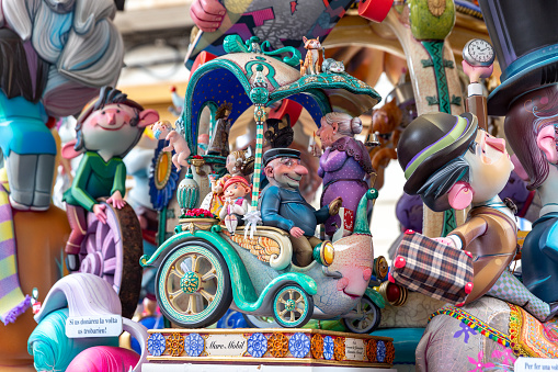 General view of a Falla during Las Fallas Festival on March 18, 2022 in Valencia, Spain. The Fallas is Valencias most international festival, which runs from March 15 until March 19. It celebrates the arrival of spring with fireworks, fiestas and bonfires made by large puppets named Ninots. During the months preceding this unique festivity, a lot of hard work and dedication is put into preparing the monumental and ephemeral cardboard statues that will be devoured by the flames. The festival has been designated as a UNESCO Intangible Cultural Heritage of Humanity since 2017. People visit and look the falla.