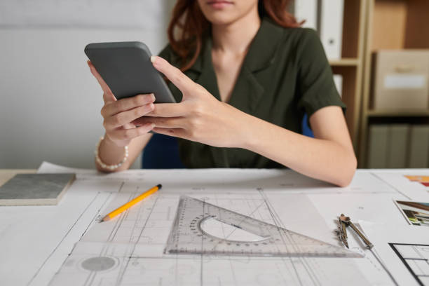 istock Architect Taking Photo of Bleuprint 1456176286