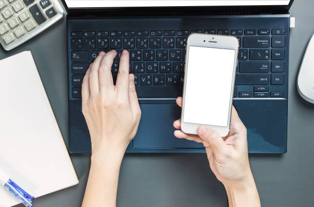 istock Flat lay of woman hand is working with typing laptop, checking data on smartphone with calculator and pen. Concepts of long-term business development, Shopping online. 1456177816