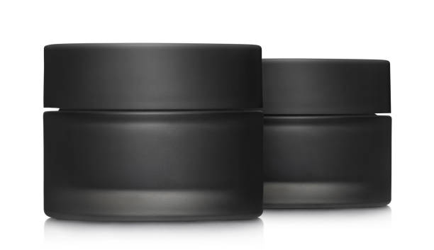 istock Black cosmetic cream jars on white 1456179138