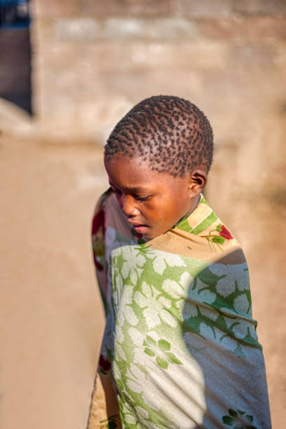 istock african child wrapped in a blanket 1456179598
