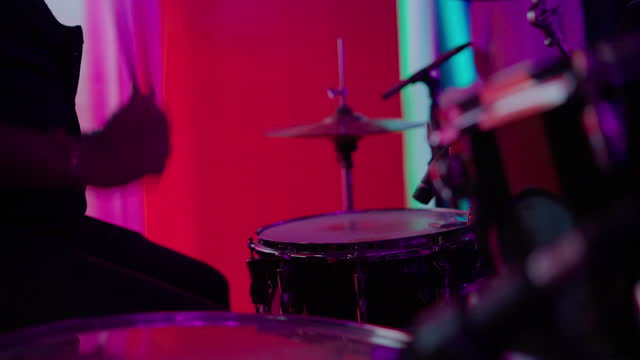 Drummer playing at night