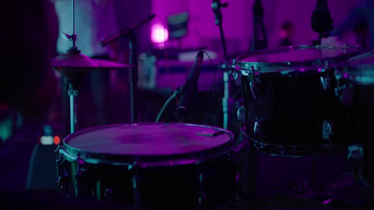 Drummer playing at night