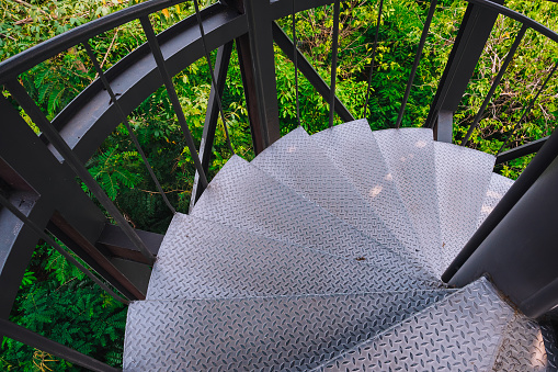 Metal spiral staircase, stair to the top of view point in the botanic garden